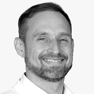 [Translate to Deutsch:] Portraitbild des Referenten in schwarz-weiß, Dr. Kämmerer