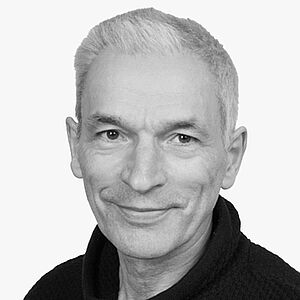 [Translate to Deutsch:] Portraitbild des Referenten in schwarz-weiß, Prof. Dr. med dent. Dr. med. Berthold Hell